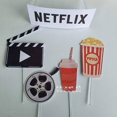 popcorn, drink and movie claps are on sticks