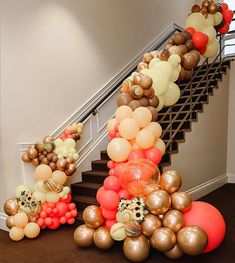 a staircase decorated with balloons and streamers