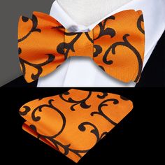 Orange and Brown Floral Self-Tie Bow Tie Close your eyes and imagine a luxurious silk bow tie in a bright orange and brown floral pattern. The intricate design of the floral pattern is captivating, with bursts of bright orange petals that seem to dance against a rich brown backdrop. The smoothness and sheen of the silk give the tie a sense of luxury and sophistication. Pair this bow tie with a crisp white dress shirt to create a classic and timeless look. The white shirt will provide the perfect Formal Orange Bow Tie, Brown Backdrop, Tie Matching, Perfect Background, White Dress Shirt, Navy Blue Suit, Silk Bow Ties, Silk Bow, Brown Suits