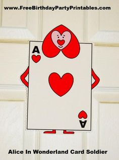 an ace in wonderland card soldier with hearts on it's chest is hanging from the front door