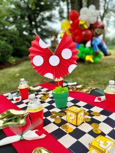 a mickey mouse party with balloons and decorations