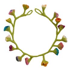 a circular frame made up of flowers and leaves with the center surrounded by smaller petals