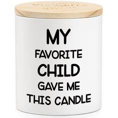 a white canister with the words'my favorite child gave me this candle '