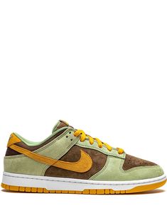 Dusty olive green/pro gold-tone leather Dunk Low sneakers from NIKE featuring signature Swoosh logo detail, branded insole, panelled design, perforated design and suede panelling. These styles are supplied by a premium sneaker marketplace. Stocking only the most sought-after footwear, they source and curate some of the most hard to find sneakers from around the world.. | Nike Dunk Low sneakers Dunk Low Dusty Olive, Adidas Human Race, Olive Sneakers, Nike Air Tailwind, Green Pro, Candy Shoes, Basketball Silhouette, New Nike Air Force, Nike T