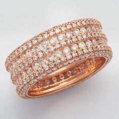 an 18k rose gold ring set with round brilliant pave cut diamonds in the center