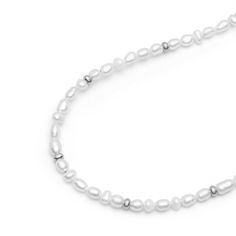 Strung by hand on a strong metal wire in our LA studio, this necklace with white pearls and silver beads will add a unique touch to all your looks. Wear this elegant piece solo or layered. We use cultured white pearls from oysters and freshwater mussels that we select by hand for all our jewelry. Approximate pearl size 4mm. Preserve the elegance of your jewelry by avoiding direct contact with perfumes, body lotions, hairspray, and other chemicals. Always remove your jewelry before going to bed, bathing, showering, swimming, or engaging in physical activities like cleaning or gardening. Protect your pieces from extreme temperatures and humidity, and ensure they are not exposed to direct sunlight. After each use, clean your jewelry with a soft cloth and store it in an airtight jewelry box to Freshwater Mussels, Before Going To Bed, Body Lotions, Mens Jewelry Necklace, Going To Bed, Forever Jewelry, Jewelry Ring Box, Pearl Choker, Metal Wire