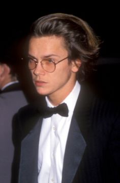 a young man in a tuxedo and bow tie