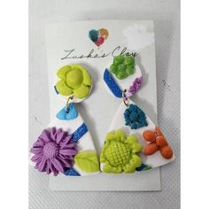 Title: Zuska's Clay Earrings Boho Floral Raised Design Handmade Clay Colorful 2.5"New Brand: Zuska's Clay Pattern: Floral Featured Refinements: Bohemian, Colorful, Raised Design, Handmade, Dangle Modified Item: No Condition: Brand New Condition Measurements Length: 2.5" We Want You To Have A Positive Experience. Please Examine The Pictures Carefully Before Purchasing! Thank You! Handmade Purple Flower Earrings Whimsical Style, Handmade Purple Whimsical Flower Earrings, Purple Handmade Whimsical Flower Earrings, Purple Flower-shaped Earrings, Handmade Green Earrings For Birthday, Whimsical Handmade Purple Earrings, Handmade Green Earrings For Birthdays, Handmade Multicolor Earrings For Birthday, Trendy Handmade Purple Earrings