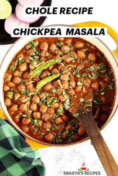 a pot filled with chickpeas next to onions and celery on a table