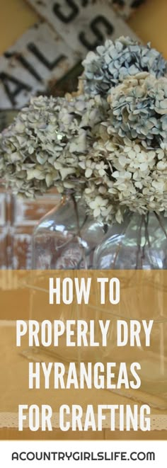 a vase filled with flowers sitting on top of a table next to a sign that says how