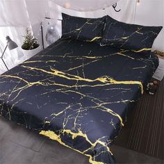 a black and yellow marbled bed spread