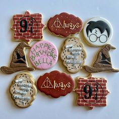 harry potter themed cookies are arranged on a white surface with the words happy birthday written across them