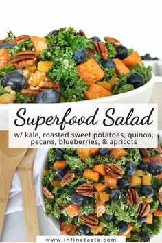 a salad with kale, roasted sweet potatoes, blueberries, and apricots