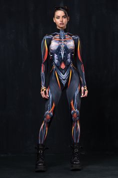 Electrify the night with our Circuit Current costume. Dare enter a universe where matter welds with technology as if one and the same, while you become the embodiment of the impending digital dominance. FEATURES: > Mock Neckline >Robust & Hidden Front Zipper Closure; >Long Sleeves >82% Polyester 18% Ela Cyberpunk Costume, Halloween Bodysuit, Robot Costumes, Alien Costume, Adult Halloween Costumes, Mock Neckline, Unique Designers, Halloween Costumes Women, Adult Costumes