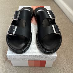 This Is Our Other Line Black Sandals Size 39 Brand New Modern Black Slides With Buckle Closure, Black Platform Slides With Flat Heel, Black Sandals With Buckle Closure And Flat Heel, Black Platform Flat Slides, Black Flat Platform Slides, Black Flat Heel Sandals With Buckle Closure, Black Flat Sandals With Buckle Closure, Black Platform Slide Footbed Sandals, Black Slip-on Sandals With Buckle Closure