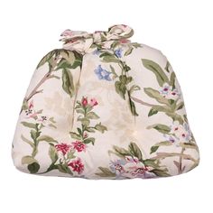 a white bag with flowers and leaves on it