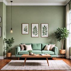 a living room with green walls and wooden flooring, two potted plants on either side of the couch