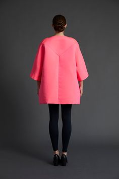 Angelina Pink Faille Niran jacket, meticulously crafted with a structured and elegant cut, adorned in a bright and stunning pink crisp faille fabric sourced from Italy. Adding a touch of enchantment, the jacket features our signature beautiful silk pink fan lining, thoughtfully imported from Italy. Embracing mid-length kimono sleeves, two handy pockets, and an alluring open front, this versatile masterpiece allows you to wear it belted or unbelted for a flawless look. Be prepared to make a state Pink Fitted Outerwear For Evening, Pink Tailored Party Outerwear, Chic Pink Evening Outerwear, Structured Evening Outerwear For Spring, Spring Silk Pink Outerwear, Structured Shoulder Outerwear For Evening, Elegant Pink Silk Outerwear, Amanda Thomas, Kimono Sleeve