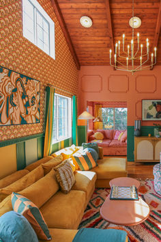 a living room filled with furniture and a chandelier