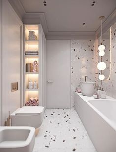 a bathroom with two sinks, a toilet and a bathtub in it's center