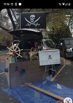 the trunk of a pirate ship is set up on top of a blue tarp