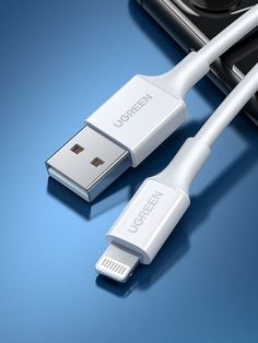 two white usb cables connected to an iphone