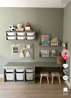 a child's playroom with toys and storage bins on the wall next to it