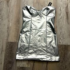 Metallic Tube Mini Dress. Size 8. Brand New! Silver Strapless Summer Dress, Silver Strapless Dress For Summer, Shiny Silver Mini Dress For Summer, Summer Shiny Silver Mini Dress, Metallic Shiny Mini Dress, Metallic Shiny Mini Length Dress, Shiny Silver Summer Dresses, Metallic Mini Dress For Spring Date Night, Silver Fitted Mini Dress