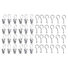 a bunch of metal hooks are shown on a white background