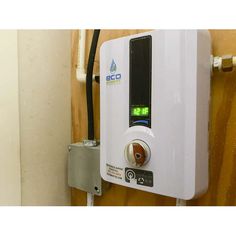 an electric water heater with thermostaer on it's back wall