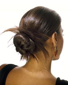 a woman with her hair in a low bun