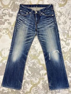 33X30 Distressed Blue Vintage Levi's 708 Jeans JN 1936 Size: 33 Actual measurement (inches): Waist - 33 Front Rise - 9.5 Hips - 40 Thigh - 11.5 Knee - 7.5 Leg Opening - 18 Inseam - 30 Outseam - 40.5 Material : Cotton  *Disclaimer: Product color may slightly vary due to photographic lighting sources or your monitor settings.  #JN1936 Classic Distressed Dark Wash Jeans, Classic Dark Wash Distressed Jeans, Classic Distressed Faded Jeans, Classic Faded Distressed Jeans, Classic Blue Distressed Jeans, Faded Denim, Grunge Style, Blue Vintage, Photographic Lighting