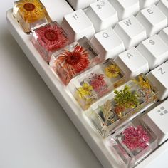 several different types of flowers are placed on the keyboard