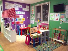 a child's playroom with toys and accessories on the floor, including tables