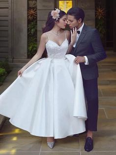 a man in a tuxedo and a woman in a wedding dress