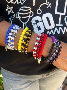 The perfect bracelet sets to throw on for Game Day! 3 stretchy strands in one set Available in Blue, Purple, Red, and Yellow Bracelet Sets, Scrubs Nursing, Western Jewelry, Red And Yellow, Men Boys, Cardigan Tops, One Set, Western Outfits, Jewelry Bags