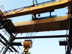 an overhead view of a construction site with workers working on the beams and lifting equipment