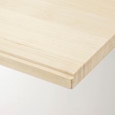 a close up of a wooden table top with no one around it or in the background