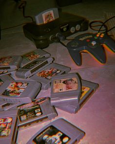 a bunch of gameboy games are laying on the floor