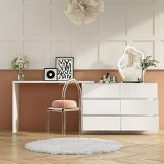 a white dresser sitting in front of a mirror on top of a wooden floor next to a chair