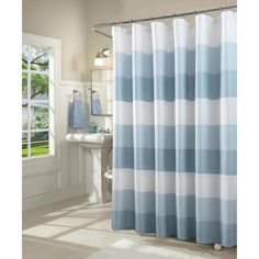 a blue and white shower curtain in a bathroom