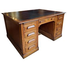 an old wooden desk with two drawers on the top and one drawer at the bottom