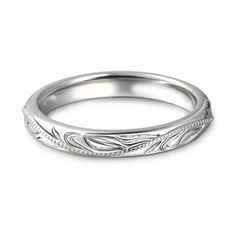 a white gold wedding band with engraved leaves