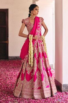 Fuchsia pink kalidar lehenga crafted in pure silk with all over Gul embroidery using zardozi, embossed motifs, intricate kasab and pearl highlights. Paired with a matching embroidered leaf neck cap sleeves cutwork border blouse and an embroidered pure silk dupatta. - Aza Fashions Embroidered Leaf, Embroidered Leaves, Fuchsia Pink