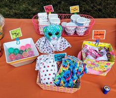 an assortment of items on a table at a children's birthday party