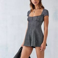 Brand: Urban Outfitters Size: Xs Color: Black Shimmer Condition: Nwt Add Metallic Detailing To Your Wardrobe With This Sparkly Romper. Complete With A Square Neck, Short Sleeves, A Fitted Bodice And Floaty Shorts. Finished With A Low Scoop To Reverse And Self-Tie Closure. Sparkly Romper, Hoodie Romper, Urban Outfitters Romper, Plaid Jumpsuit, Flowy Romper, Cutout Shorts, Fitted Romper, Belted Romper, Urban Outfitters Women