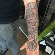 a person with a tattoo on their arm and hand