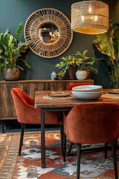 a dining room table with two chairs and a bowl on it, in front of a mirror