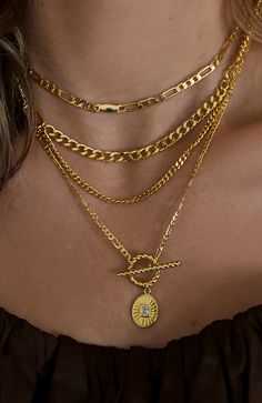 COLOR: GOLD DETAILS 18k gold plated brass 15.5 inches with a 2 inch extension chain Features white zircon stone details Denim Accessories, Gold Necklace Layered, New Pins, Gold Details, Aesthetic Clothes, Timeless Elegance, Chain Necklace, 18k Gold, Gold Necklace