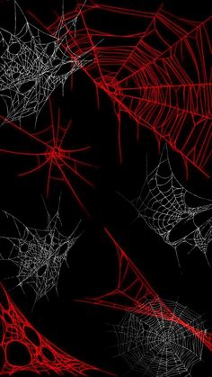 red and white spider webs against a black background